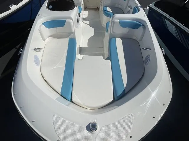 Slide: The Image of 2023 Bayliner Boats E18 interior with white and blue seating. - 7