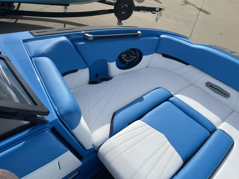 Slide: The Image of 2023 Supra SUPRA SA 450 boat interior with blue and white seating. - 11