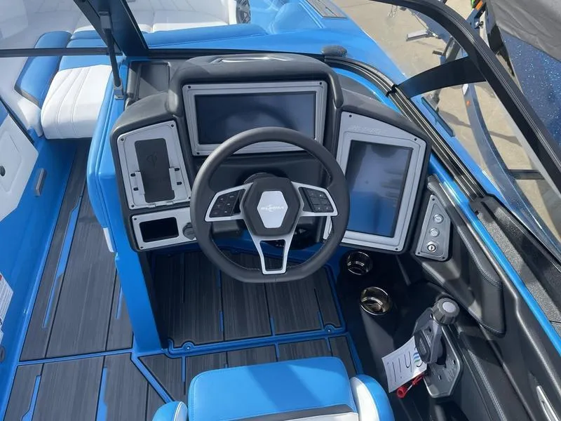 Slide: The Image of 2023 Supra SA 450 boat cockpit with modern steering and digital displays. - 16