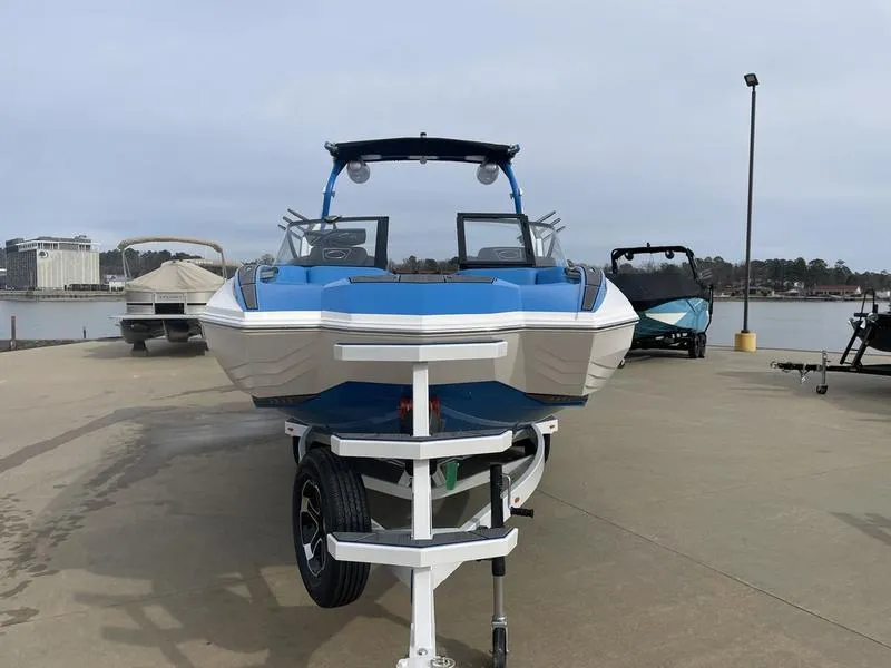 Slide: The Image of 2023 Supra SUPRA SA 450 boat on trailer by the waterfront. - 3