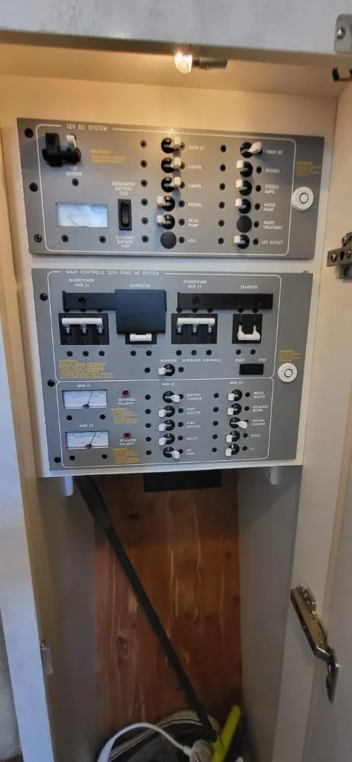 Slide: The Image of Electrical panel inside a 2002 Formula 37 PC boat, featuring various switches and controls. - 15