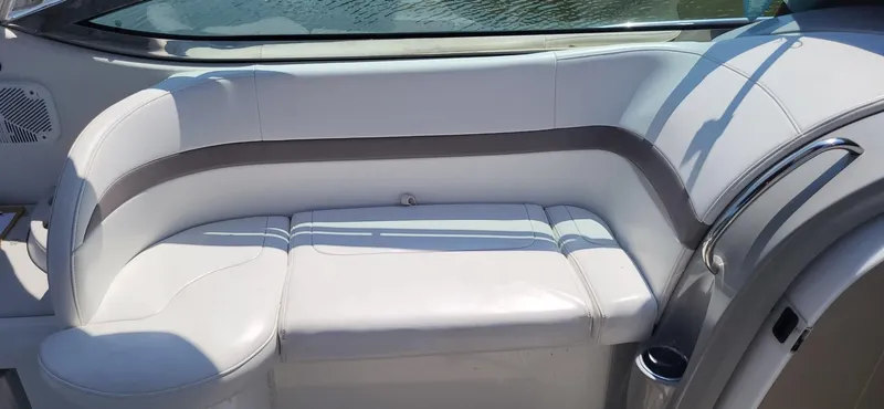 Slide: The Image of 2002 Formula 37 PC boat interior with white leather seating and sleek design. - 8