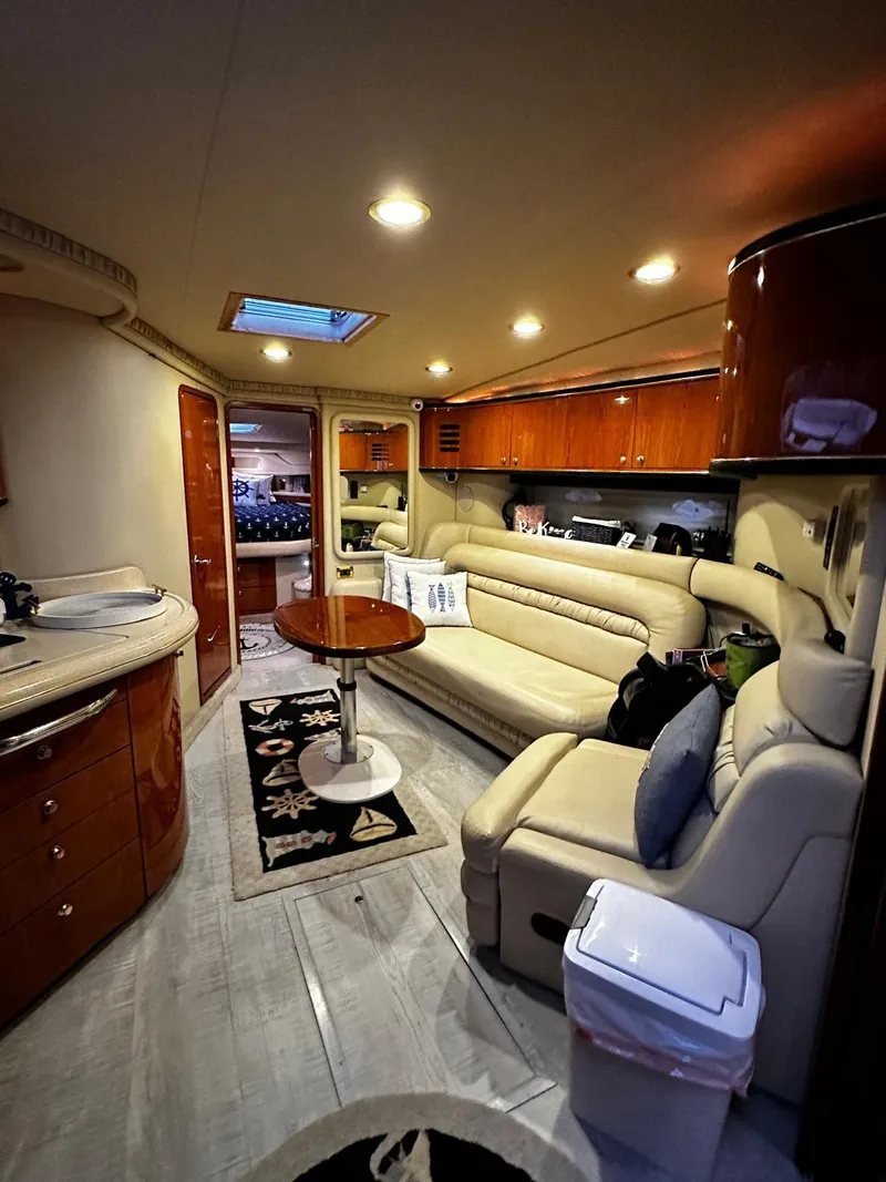 Slide: The Image of Luxurious interior of 2000 Sea Ray 460 Sundancer yacht with elegant seating and lighting. - 10