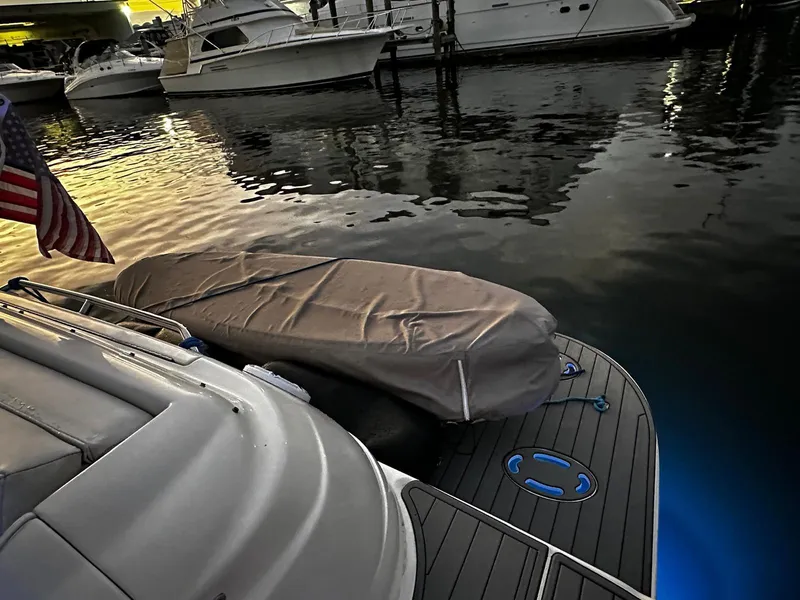 Slide: The Image of Sea Ray 460 Sundancer 2000 docked at sunset with covered dinghy. - 6