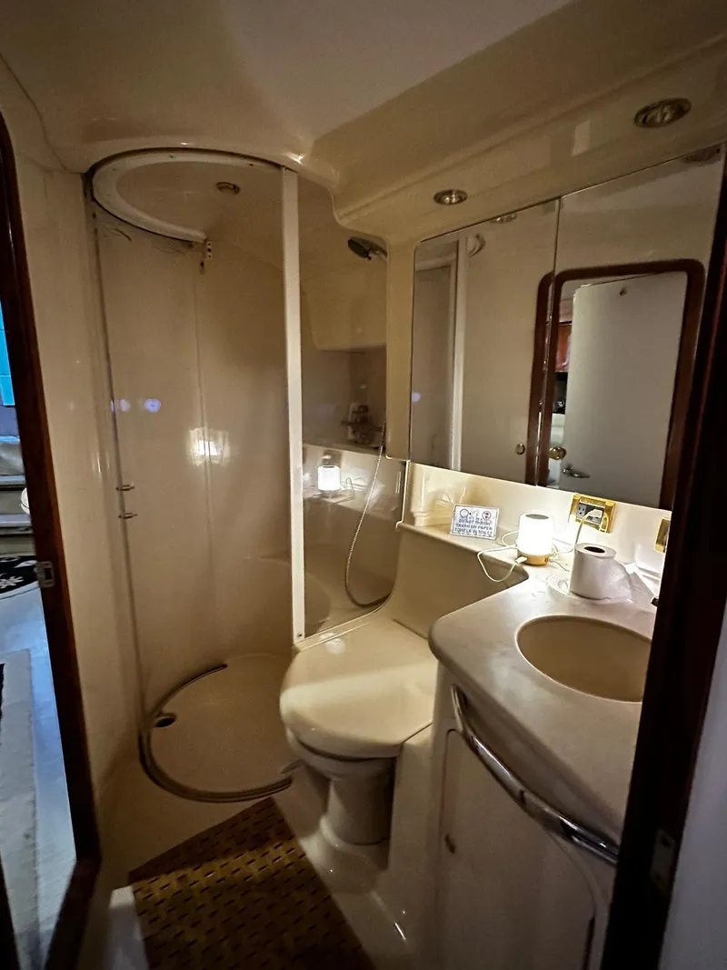 Slide: The Image of Luxurious bathroom in 2000 Sea Ray 460 Sundancer yacht with shower and vanity. - 9