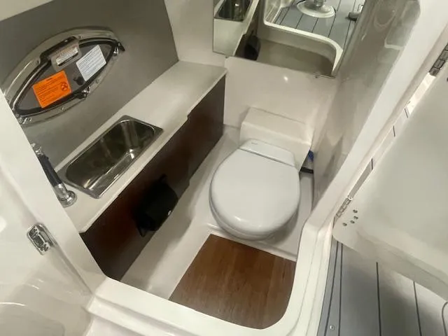 Slide: The Image of 2025 Chaparral 267 SSX boat interior with sleek seating and modern dashboard design. - 12