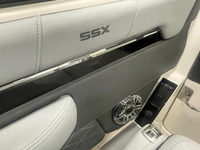 Slide: The Image of 2025 Chaparral 267 SSX boat interior bathroom with sink and toilet. - 13