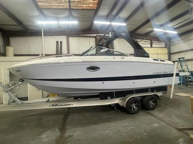 Slide: The Image of 2025 Chaparral 267 SSX boat on trailer in a garage setting. - 2