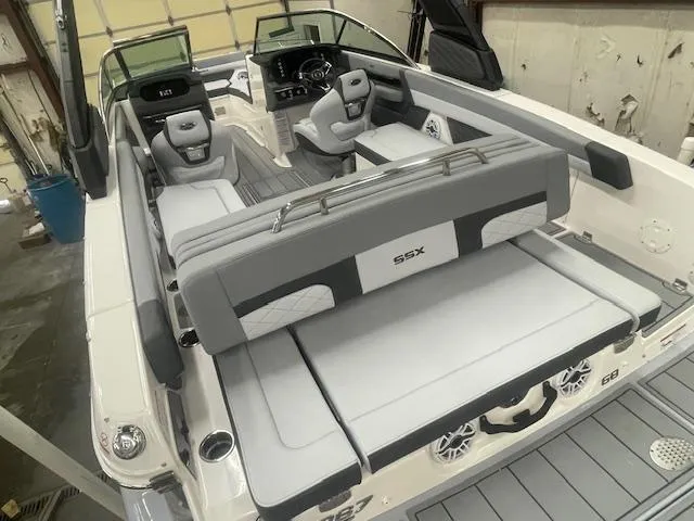 Slide: The Image of 2025 Chaparral 267 SSX boat interior with sleek seating and modern dashboard. - 4