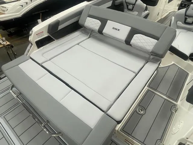 Slide: The Image of 2025 Chaparral 267 SSX boat interior with luxurious seating and modern dashboard. - 5