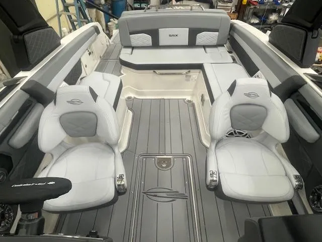 Slide: The Image of 2025 Chaparral 267 SSX boat interior with gray seating and SSX logo. - 6