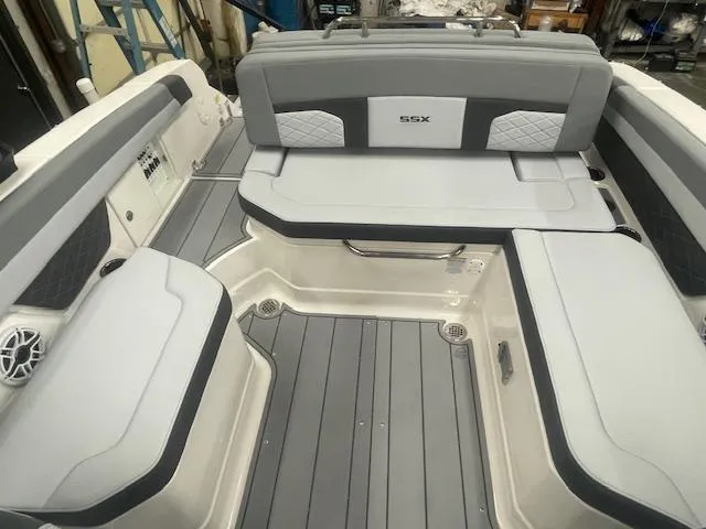 Slide: The Image of 2025 Chaparral 267 SSX boat interior with luxurious seating and sleek design. - 7