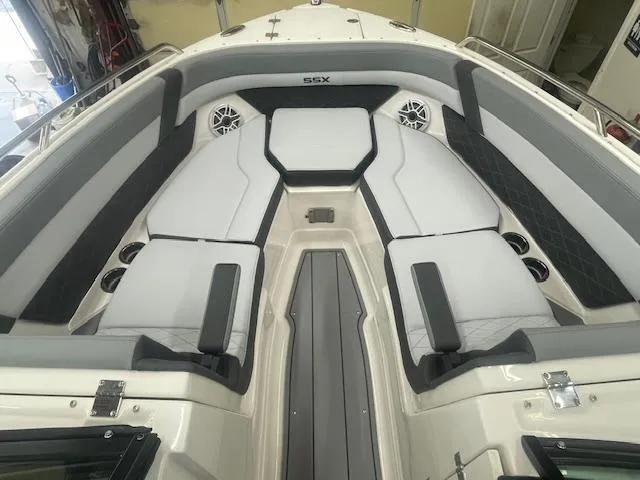 Slide: The Image of 2025 Chaparral 267 SSX boat interior with gray seating and SSX logo. - 8