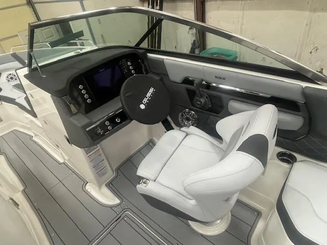 Slide: The Image of 2025 Chaparral 267 SSX boat interior with sleek seating and modern design. - 9