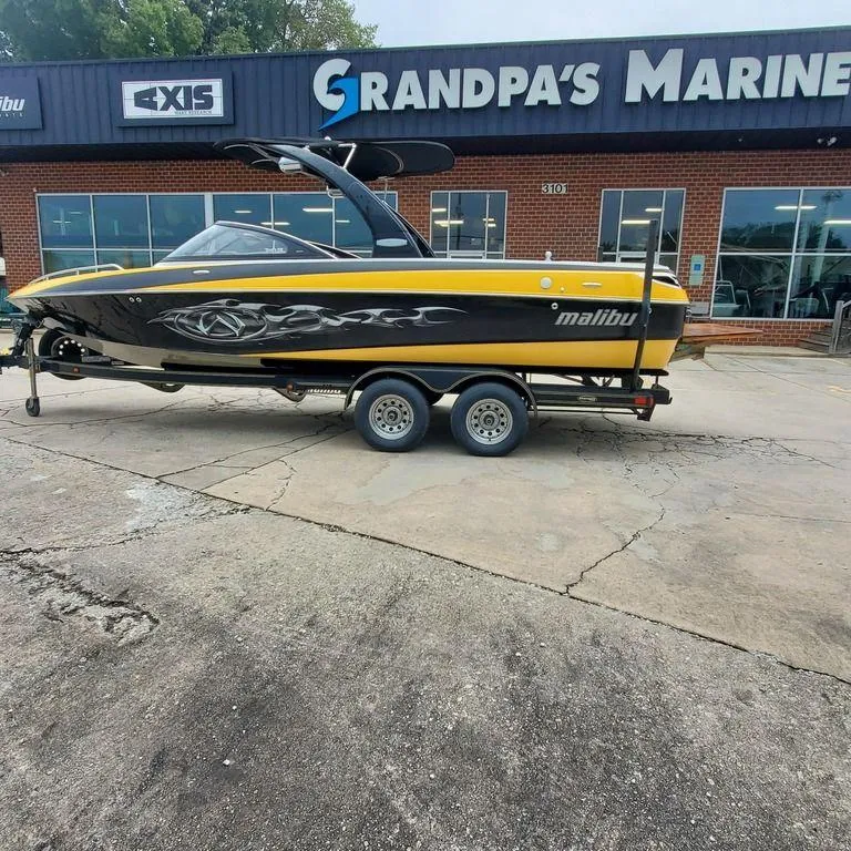 The Image of 2006 Malibu 23 LSV boat on trailer at Grandpa's Marine dealership. - 1