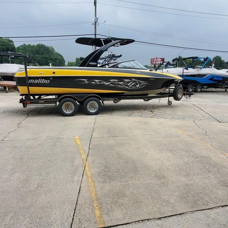 Slide: The Image of 2006 Malibu 23 LSV boat on trailer in parking lot. - 10