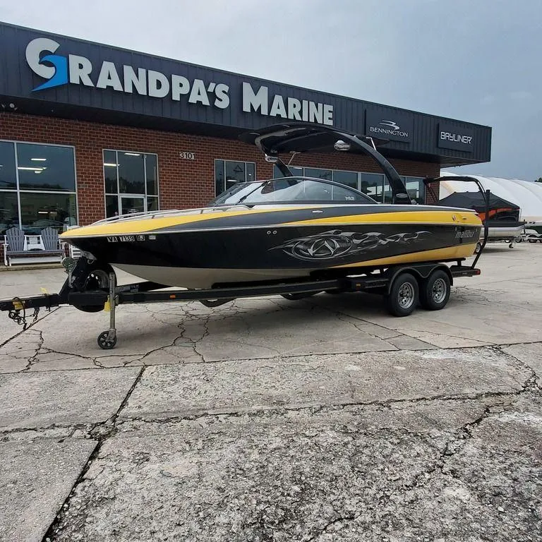 Slide: The Image of 2006 Malibu 23 LSV boat on trailer at Grandpa's Marine dealership. - 5