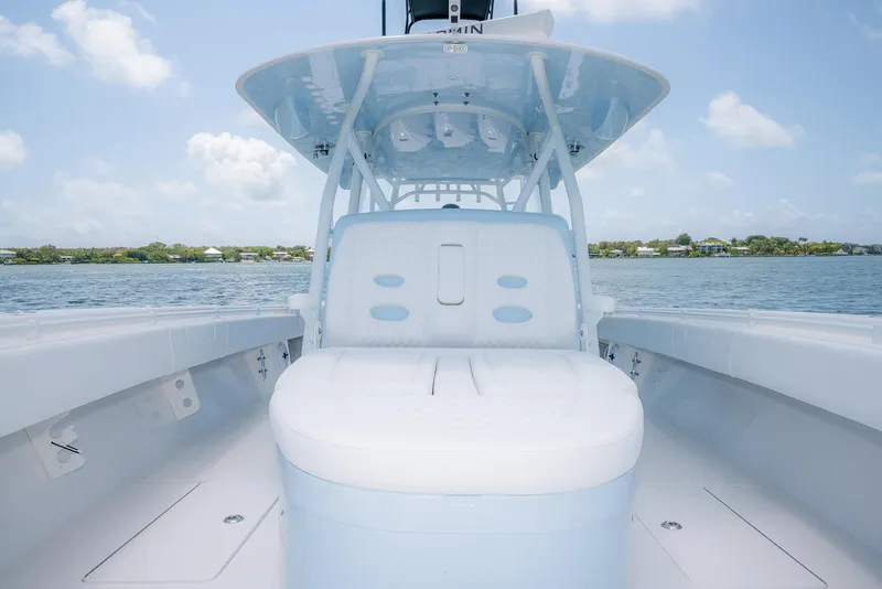 Slide: The Image of 2022 Contender 44ST boat with spacious seating on calm water. - 15