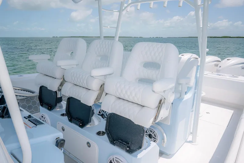 Slide: The Image of 2022 Contender 44ST boat with luxurious white seating on open water. - 18