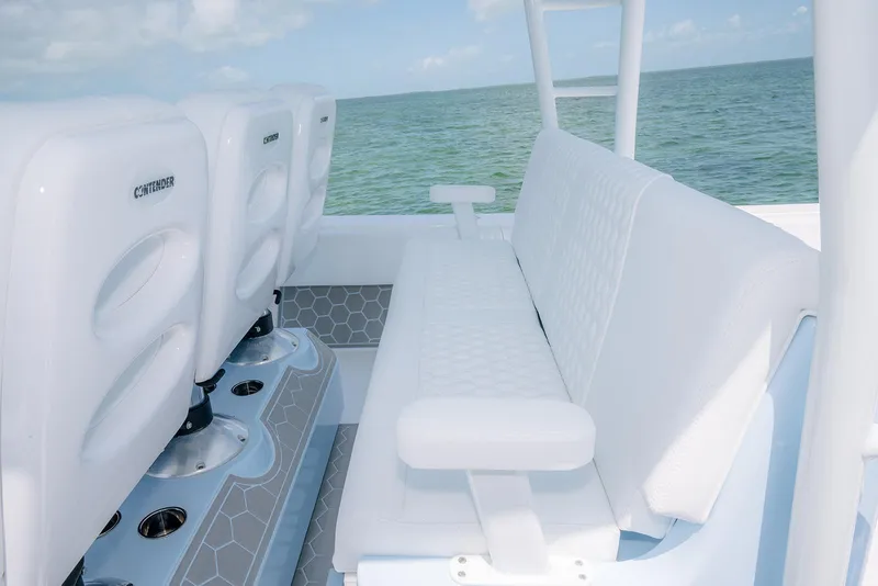 Slide: The Image of 2022 Contender 44ST boat interior with white seating, ocean view. - 19