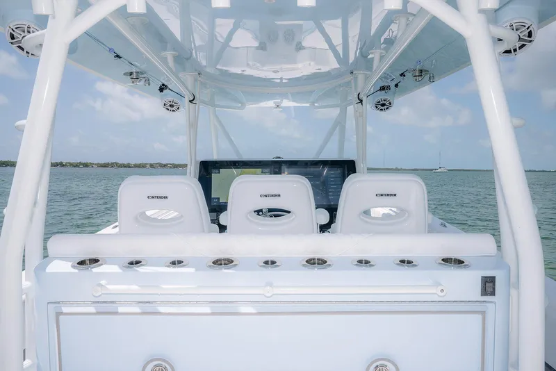 Slide: The Image of 2022 Contender 44ST boat interior with helm seats and ocean view. - 21