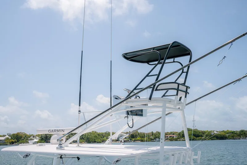 Slide: The Image of 2022 Contender 44ST boat with tower and Garmin equipment on a sunny day. - 5