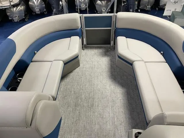 Slide: The Image of 2025 South Bay LE pontoon boat interior with gray and blue seating. - 5