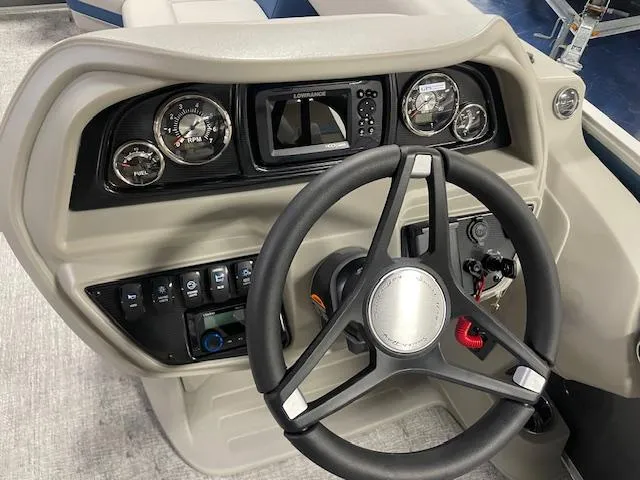 Slide: The Image of 2025 South Bay LE boat dashboard with steering wheel and control panel. - 6