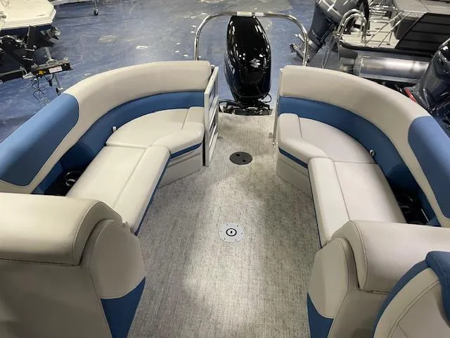 Slide: The Image of 2025 South Bay LE pontoon boat interior with blue and white seating. - 8