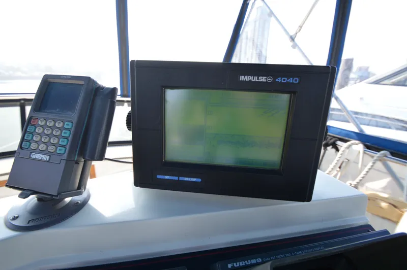 Slide: The Image of Garmin and Impulse 4040 navigation systems on 1991 Carver 43 Cockpit Motoryacht. - 15