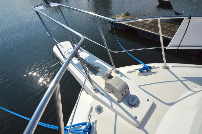 Slide: The Image of 1991 Carver 43 Cockpit Motoryacht bow with railing and anchor system. - 28