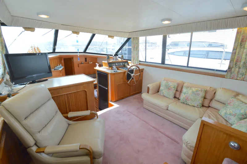 Slide: The Image of Interior of 1991 Carver 43 Cockpit Motoryacht with plush seating and helm station. - 31