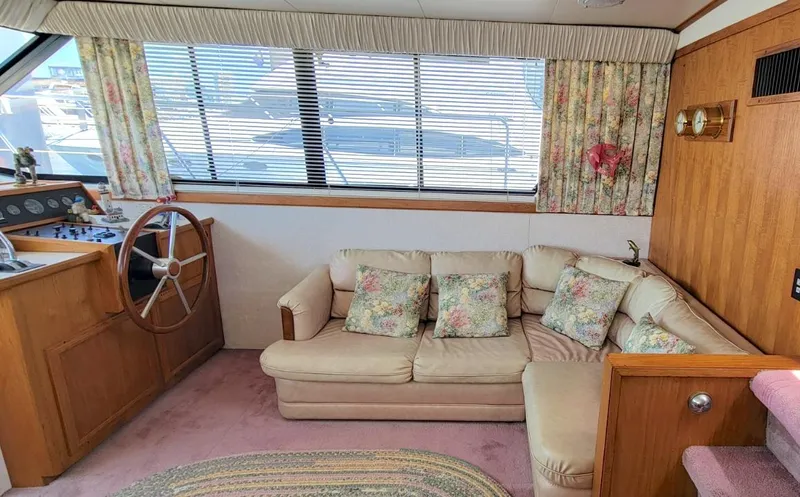 Slide: The Image of Interior of 1991 Carver 43 Cockpit Motoryacht with cozy seating and helm. - 32