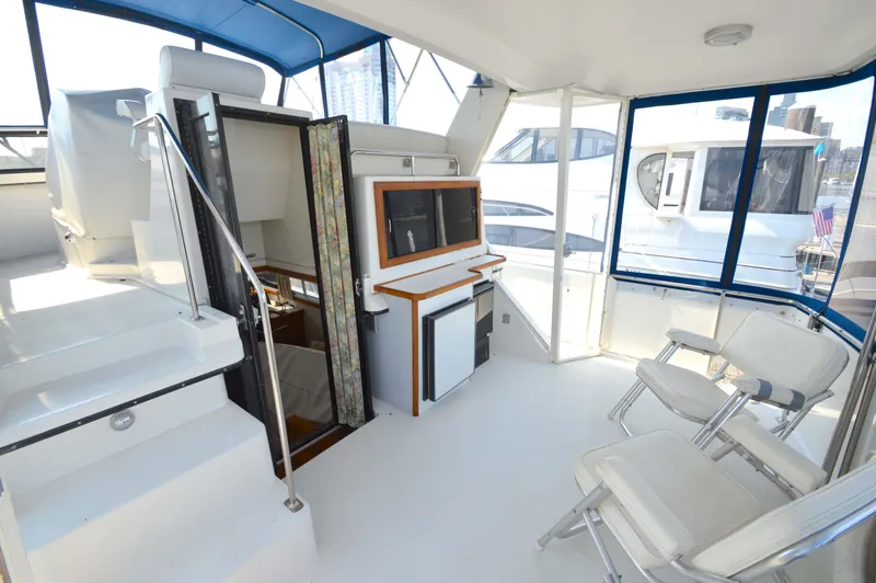 Slide: The Image of 1991 Carver 43 Cockpit Motoryacht interior with seating and helm station. - 4