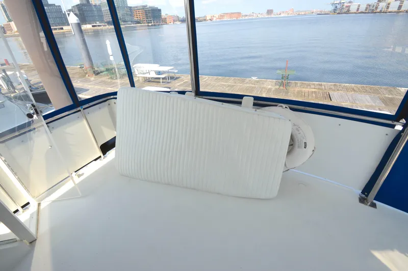 Slide: The Image of 1991 Carver 43 Cockpit Motoryacht interior with waterfront view. - 8