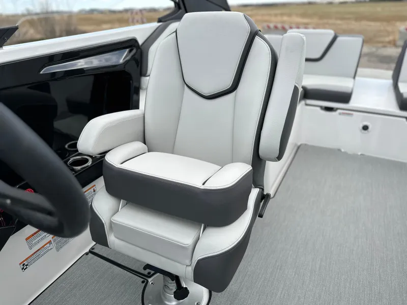 Slide: The Image of 2025 Yamaha Boats AR250 captain's chair, featuring sleek design and comfortable seating. - 13