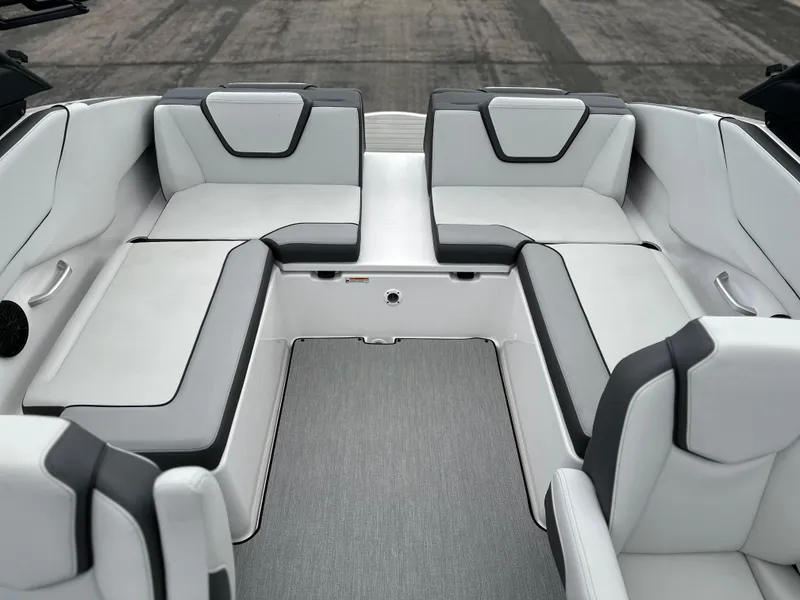 Slide: The Image of 2025 Yamaha Boats AR250 interior with sleek, modern seating and spacious layout. - 15