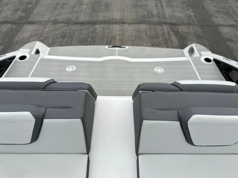 Slide: The Image of 2025 Yamaha Boats AR250 interior with sleek gray seating and modern design. - 16