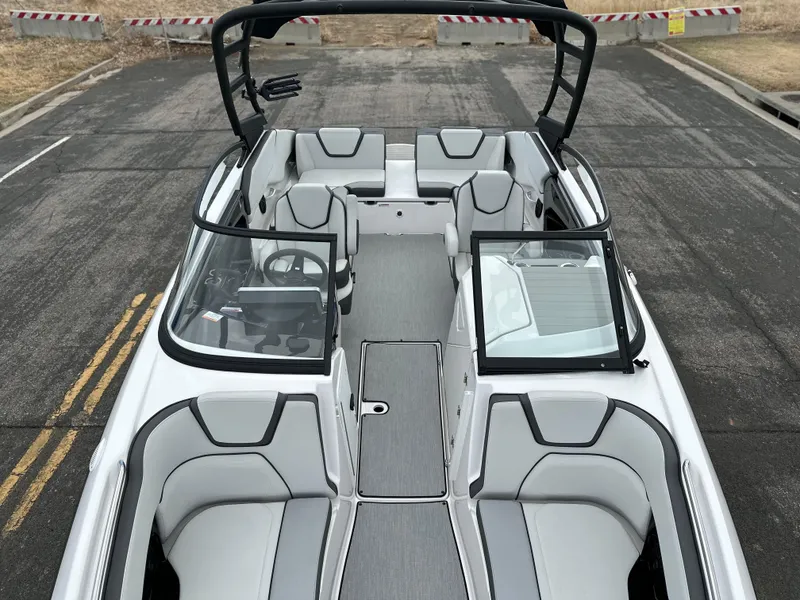 Slide: The Image of 2025 Yamaha Boats AR250 interior with sleek seating and modern design. - 9