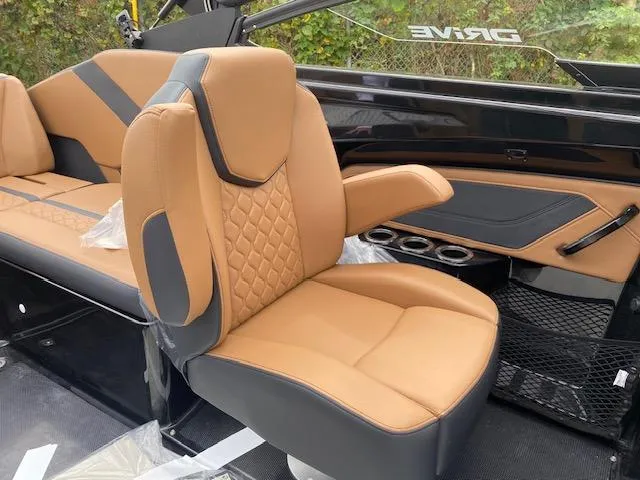 Slide: The Image of 2025 Yamaha Boats 255XD interior with tan leather seating and modern design. - 10