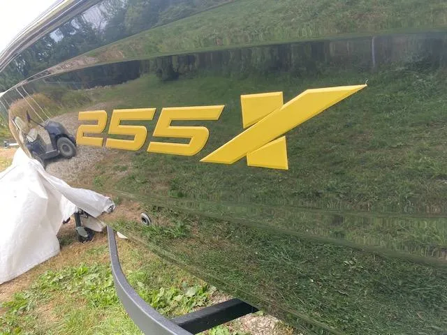 Slide: The Image of 2025 Yamaha Boats 255XD with bold yellow "255X" logo on sleek hull. - 3