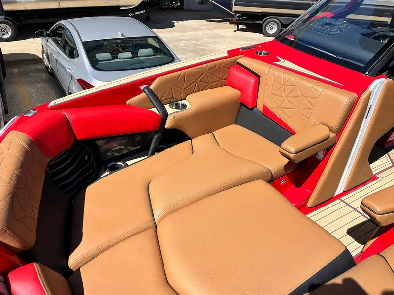Slide: The Image of 2021 Nautique Super Air Nautique G25 Paragon with luxurious tan and red seating. - 13