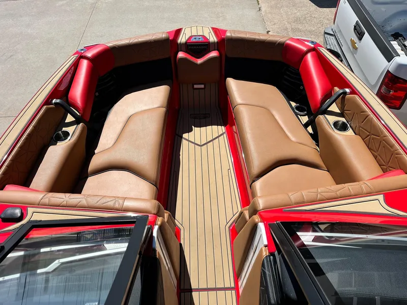 Slide: The Image of 2021 Nautique Super Air Nautique G25 Paragon interior with red and tan seating. - 15