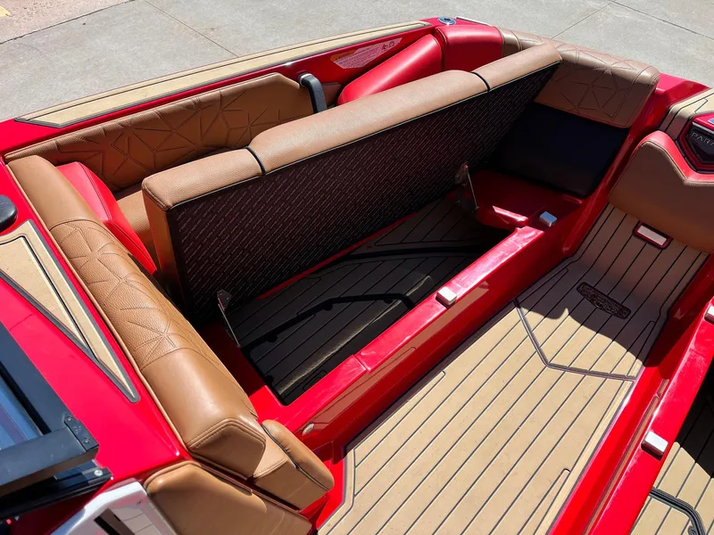 Slide: The Image of 2021 Nautique Super Air Nautique G25 Paragon interior with red and tan seating. - 16