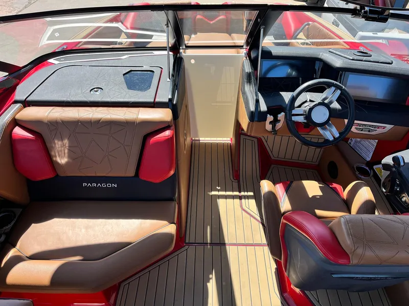 Slide: The Image of 2021 Nautique Super Air Nautique G25 Paragon interior with luxurious seating and modern dashboard. - 18