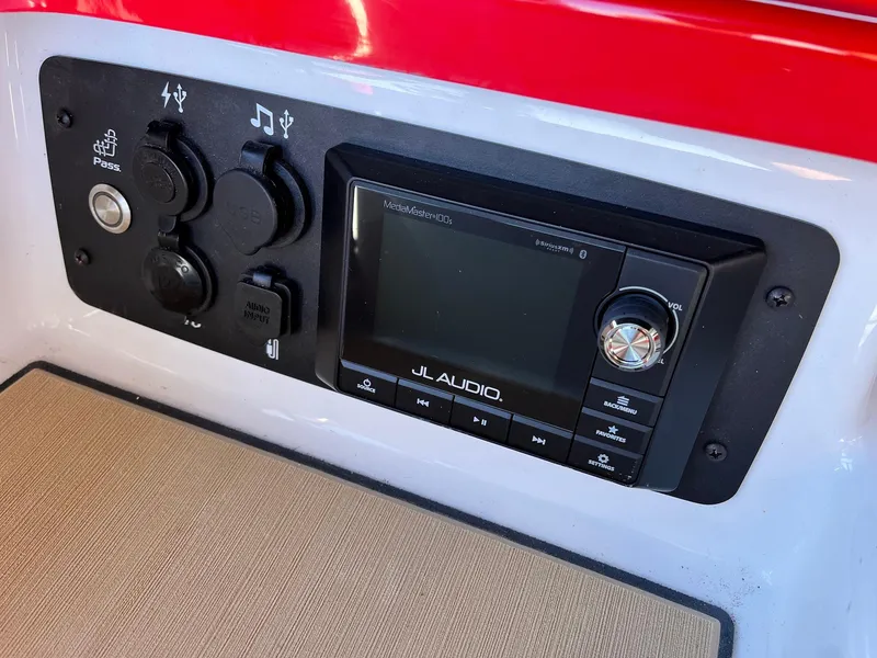 Slide: The Image of Control panel of 2021 Nautique Super Air Nautique G25 Paragon with JL Audio system. - 22