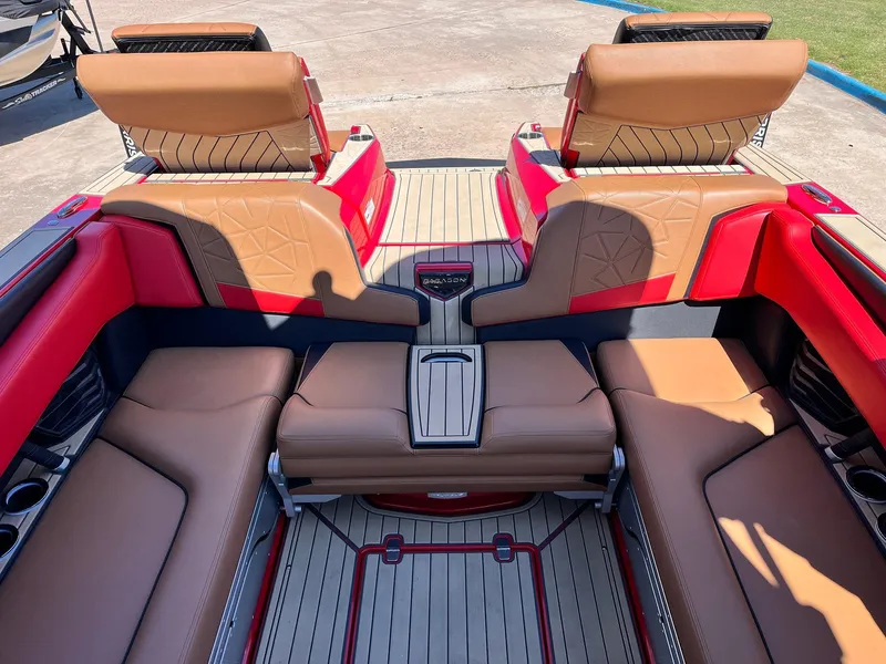 Slide: The Image of 2021 Nautique Super Air Nautique G25 Paragon interior with red and tan seating. - 32