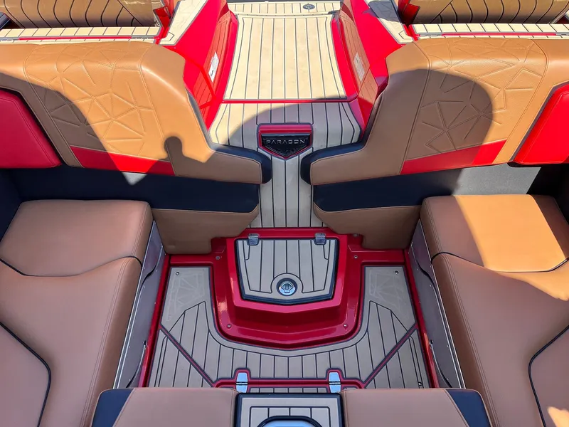 Slide: The Image of 2021 Nautique Super Air Nautique G25 Paragon interior with tan and red seating, teak flooring. - 37