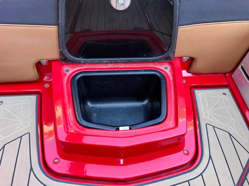 Slide: The Image of Red storage compartment on 2021 Nautique Super Air Nautique G25 Paragon boat. - 38