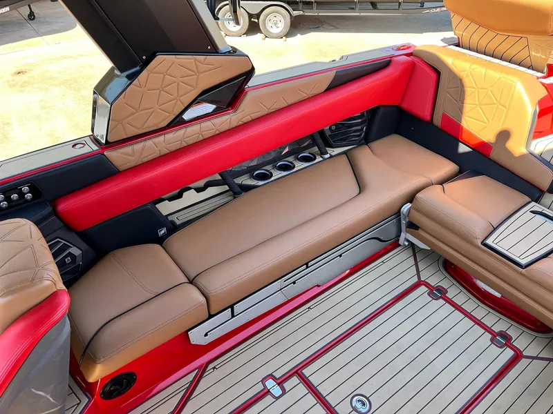 Slide: The Image of 2021 Nautique Super Air Nautique G25 Paragon interior with red and tan seating. - 39